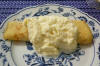 Containing Nutella and nuts, covered in whip cream.